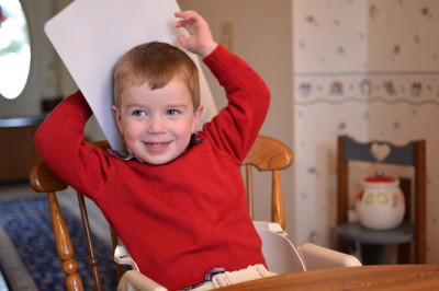 Having trouble containing his excitement before opening presents!